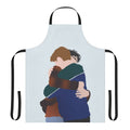 A custom apron featuring a graphic of Charlie Spring and Nick Nelson from the Netflix series Heartstopper hugging.