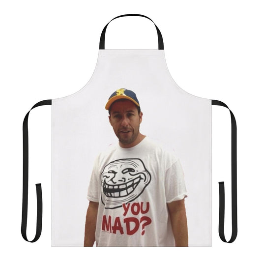 An apron featuring a parody image of Adam Sandler wearing a 'U Mad' t-shirt