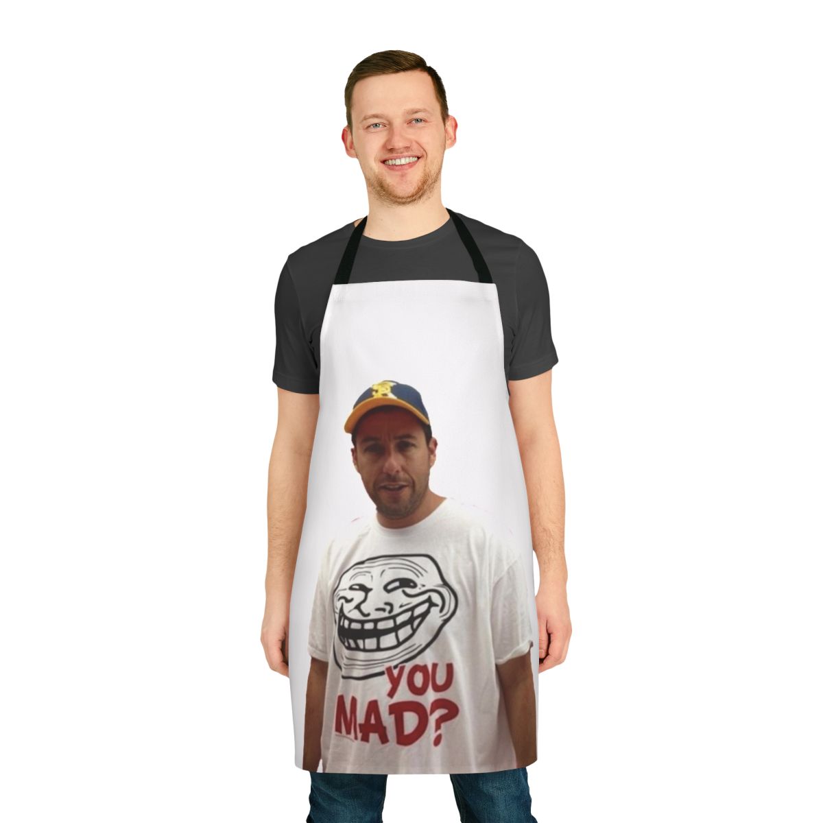 An apron featuring a parody image of Adam Sandler wearing a 'U Mad' t-shirt