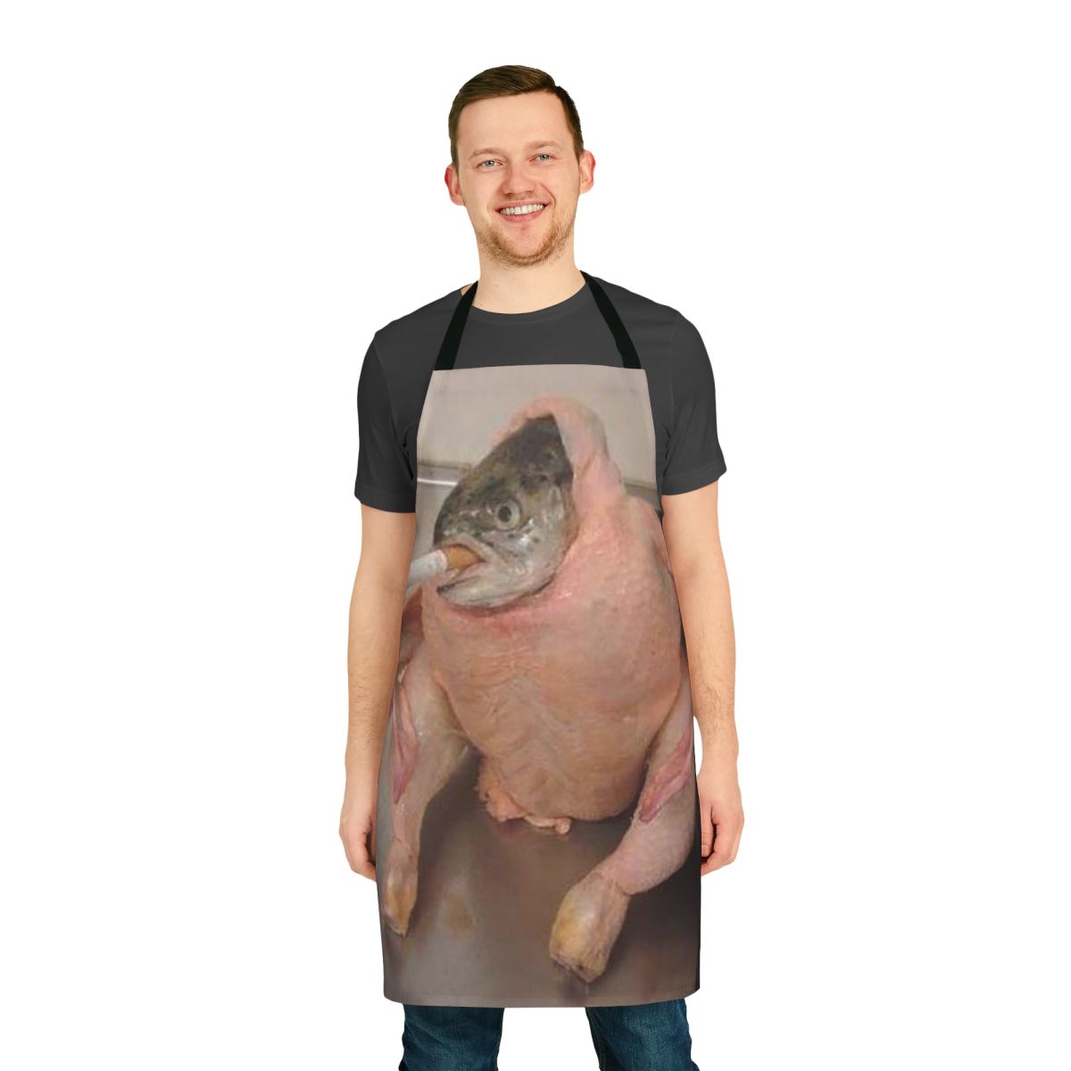 Person wearing a funny apron with a fish in a chicken design