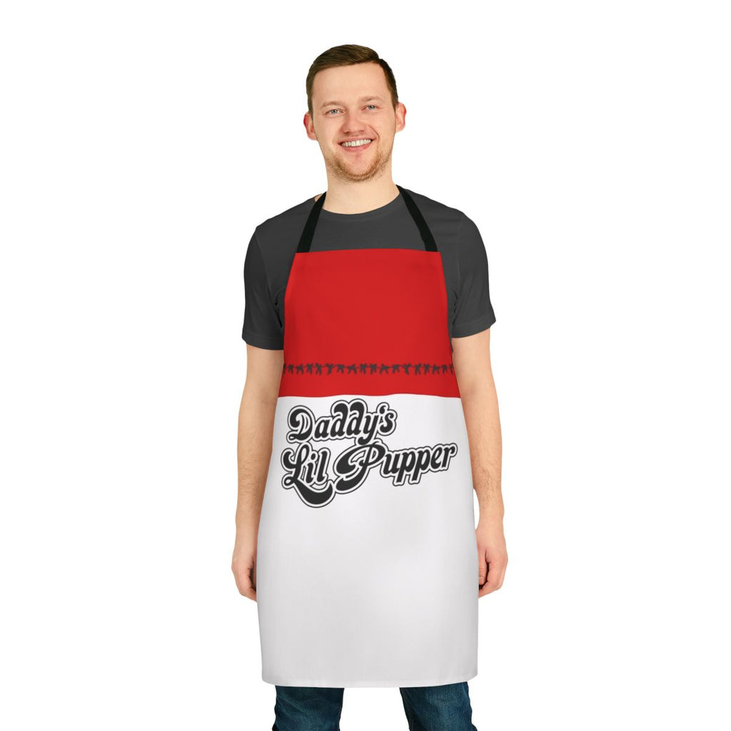 A black apron with the text "Daddy's Lil Pupper" in a fun, pop art style