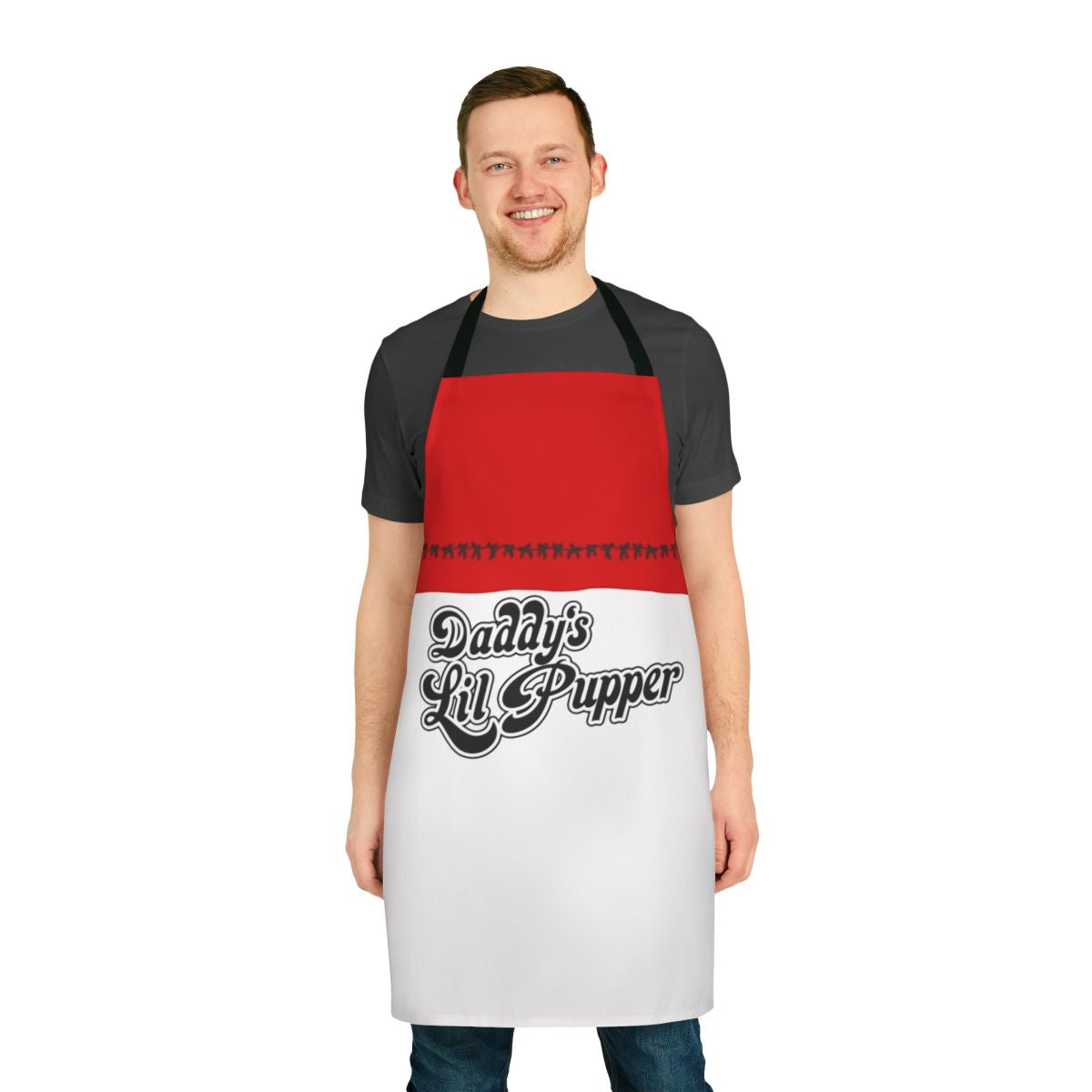 A black apron with the text "Daddy's Lil Pupper" in a fun, pop art style