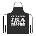 A white apron with a "Clip Clop I'm a Little Show Pony" design, inspired by the Netflix series Big Mouth.