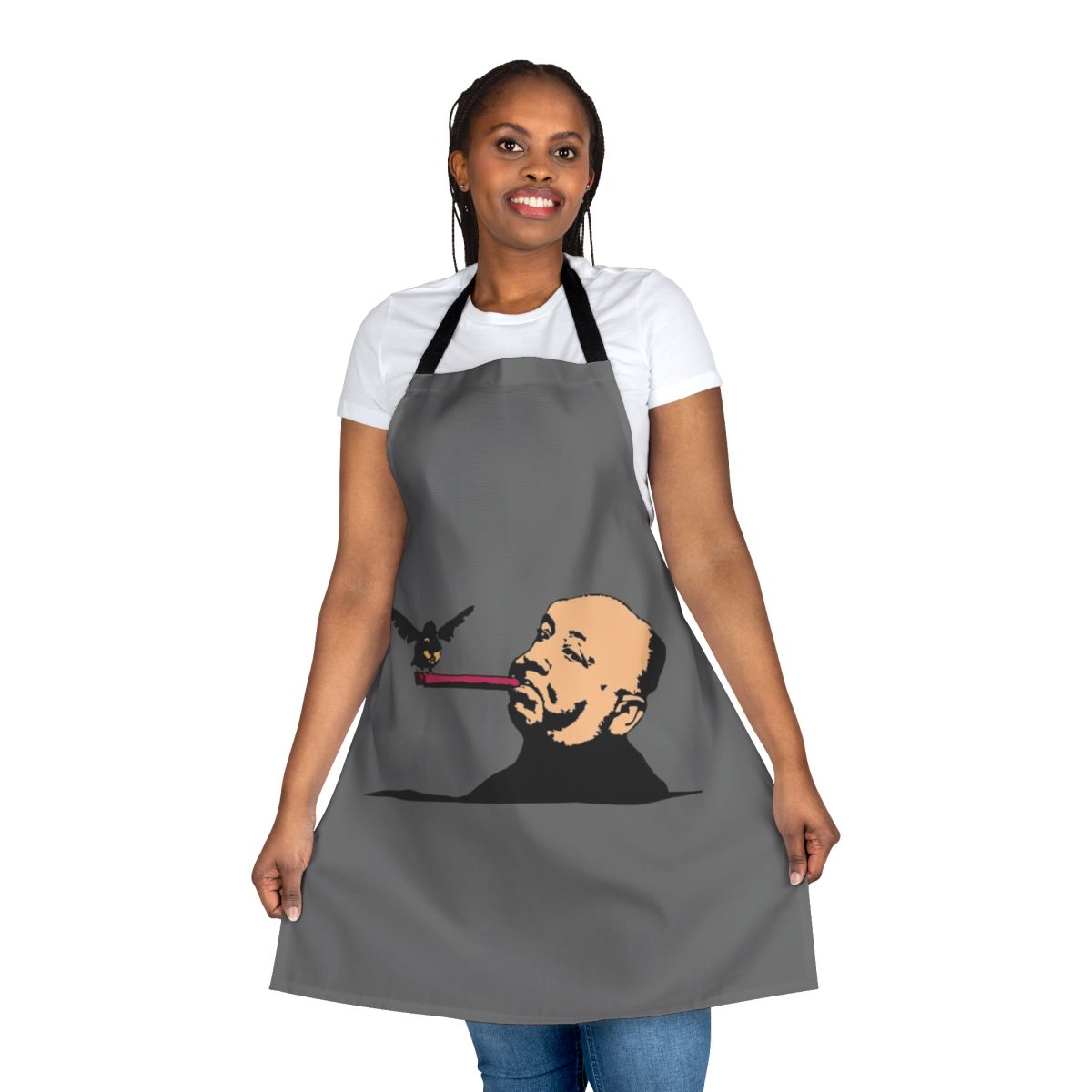 An Alfred Hitchcock-inspired apron featuring a bold bird and cigar graphic.