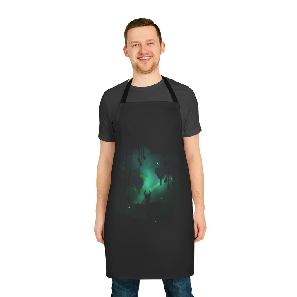 A stylized apron featuring elements from the Hollow Knight video game series, including leaves, insects, and a dark, leafy design.