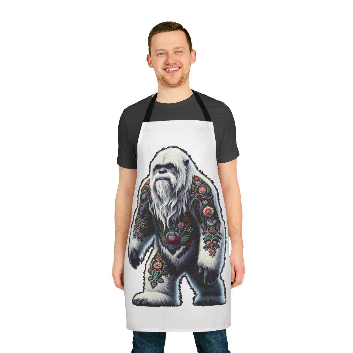 An apron featuring an embroidered design of the legendary yeti or bigfoot creature.