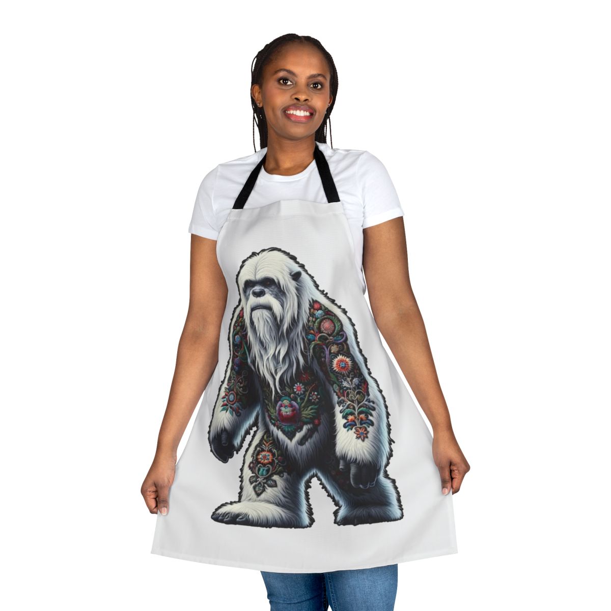 An apron featuring an embroidered design of the legendary yeti or bigfoot creature.