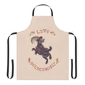 A witch-themed apron with a goat design, perfect for fall and Halloween cooking