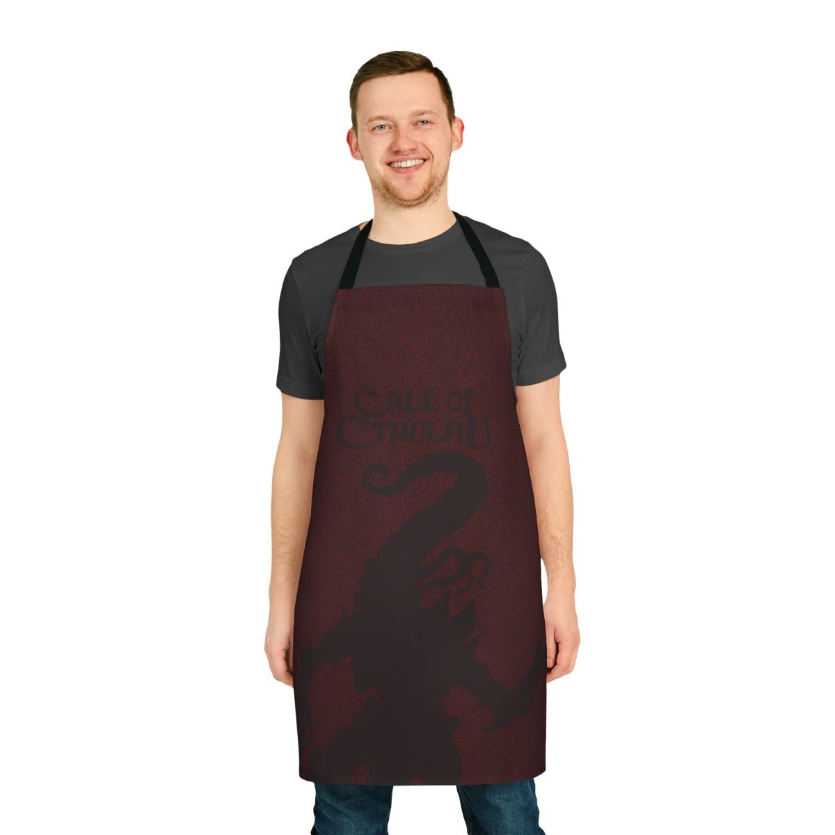 Apron featuring the text "The Horror Between The Lines Nyarlathotep" on a dark background, inspired by H.P. Lovecraft's Cthulhu Mythos.