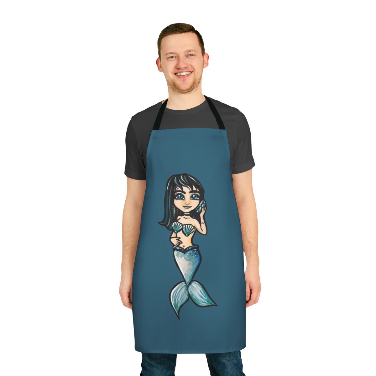 A black-haired mermaid-inspired apron with a seashell design, perfect for cooking and baking.
