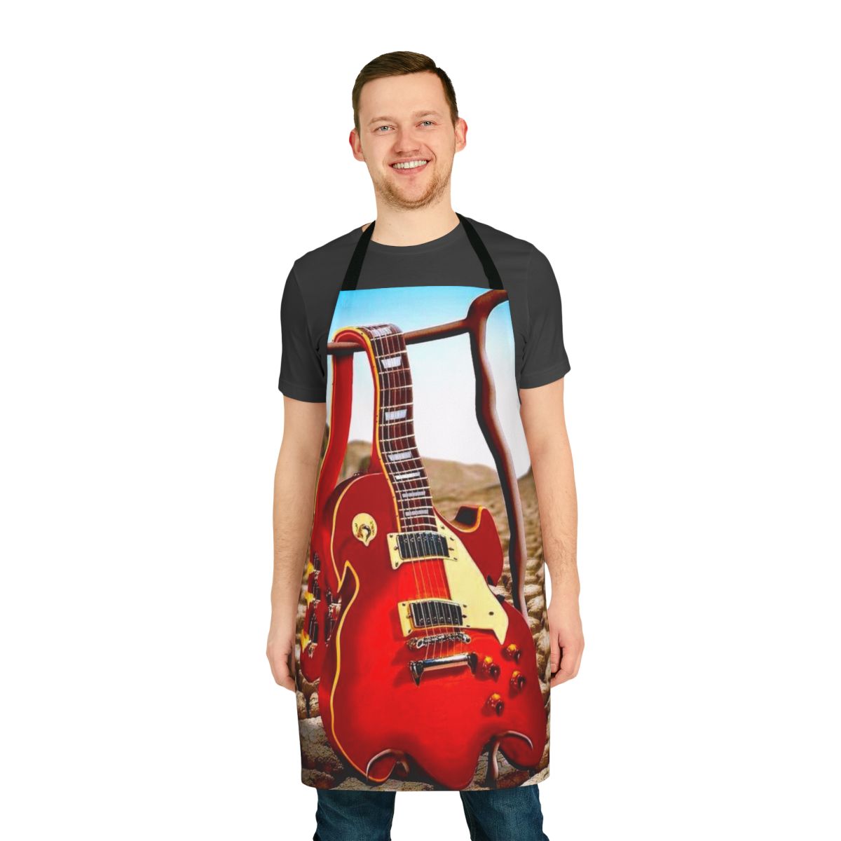 Melted guitar illustration in a surreal desert landscape on an apron