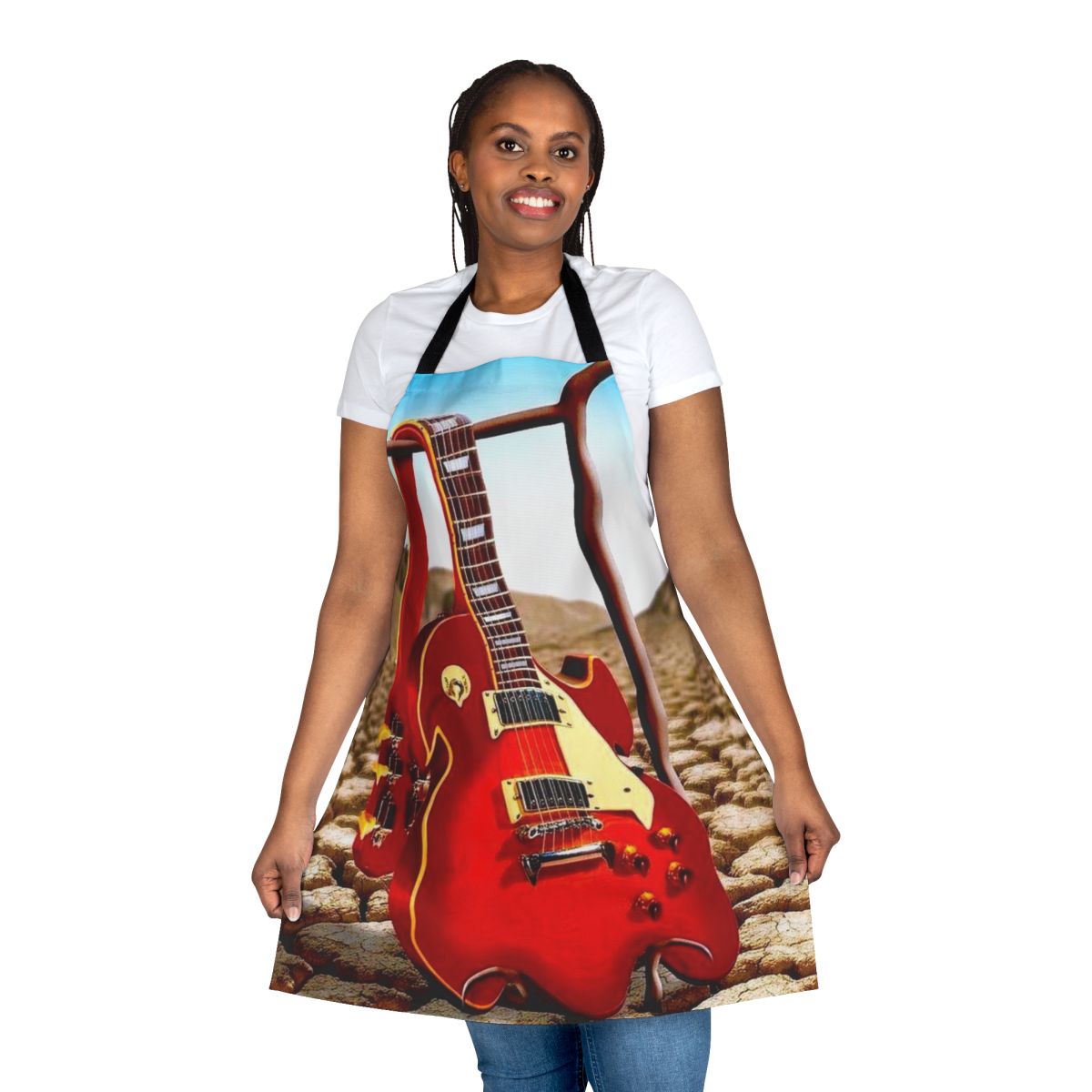 Melted guitar illustration in a surreal desert landscape on an apron