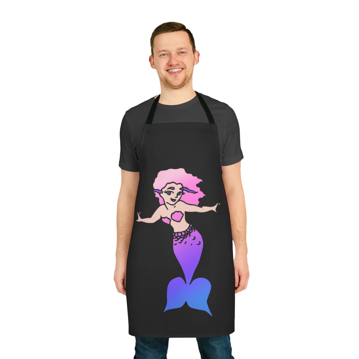 A whimsical mermaid-themed apron for kids, featuring a pink and blue design with a mermaid motif.