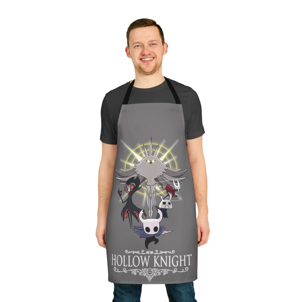 Hollow Knight-themed apron with a pixel art design, suitable for kitchen use or as a gamer accessory.