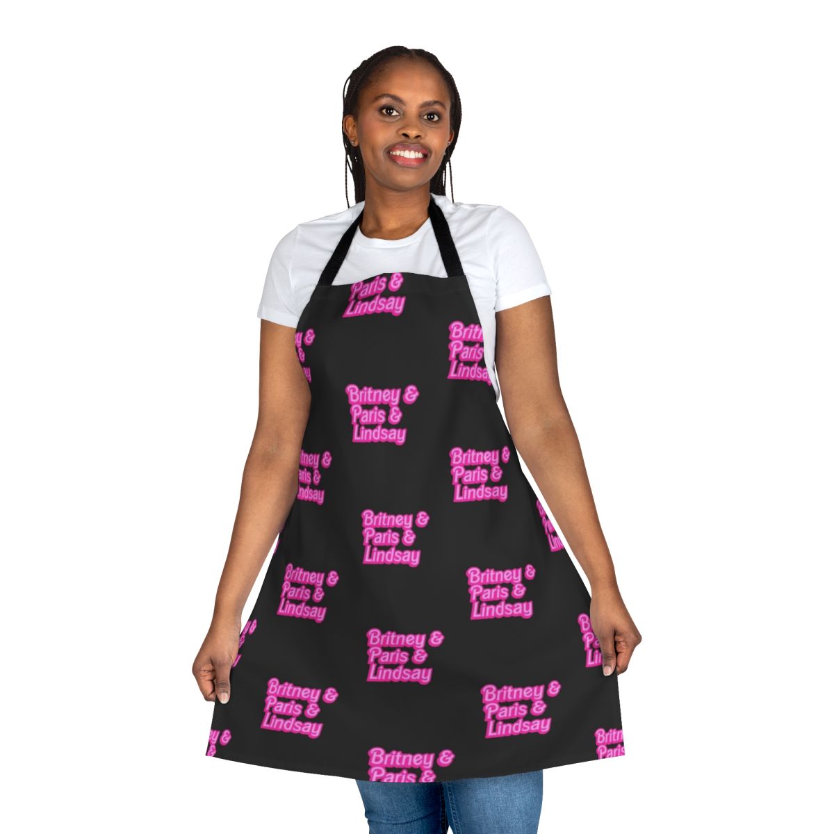 Baby pink apron with Barbie-inspired font, featuring the names of iconic millennial celebrities Britney Spears, Paris Hilton, and Lindsay Lohan.