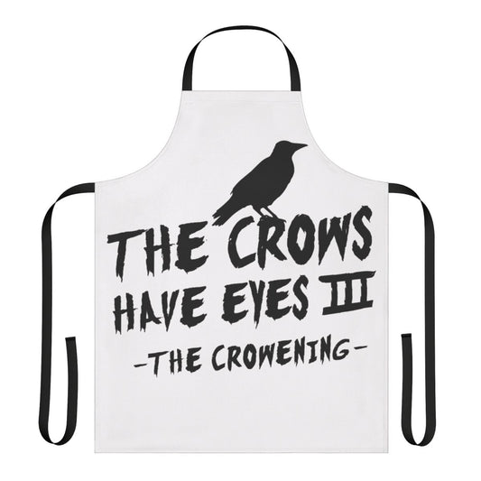 A black and white minimalist apron with a crow-themed design, inspired by the television show Schitt's Creek.