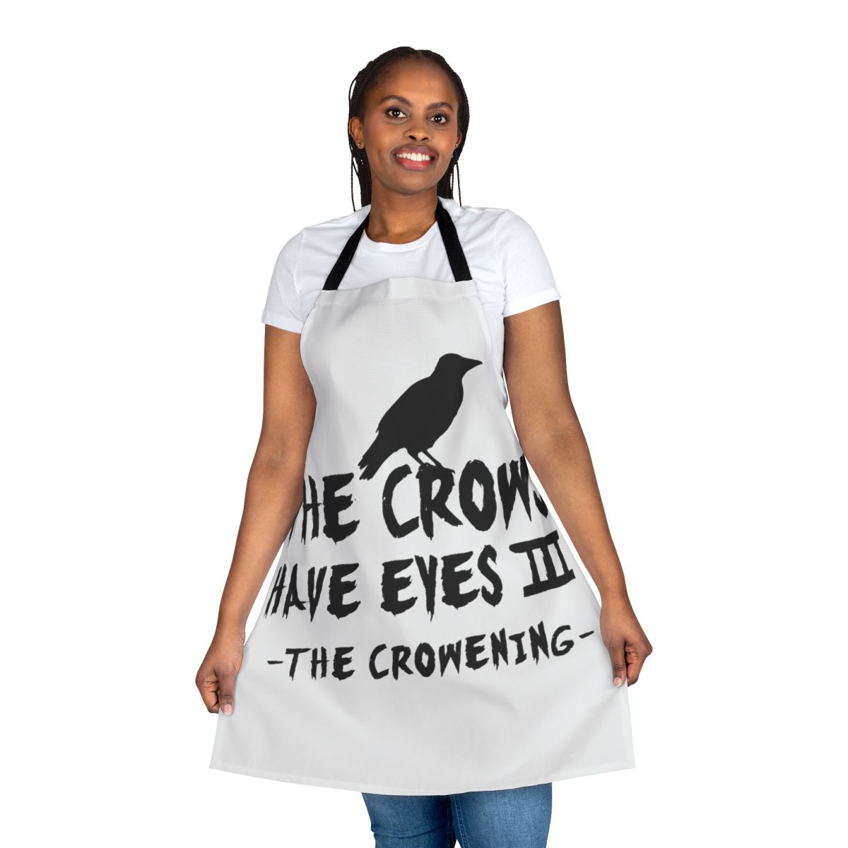 A black and white minimalist apron with a crow-themed design, inspired by the television show Schitt's Creek.