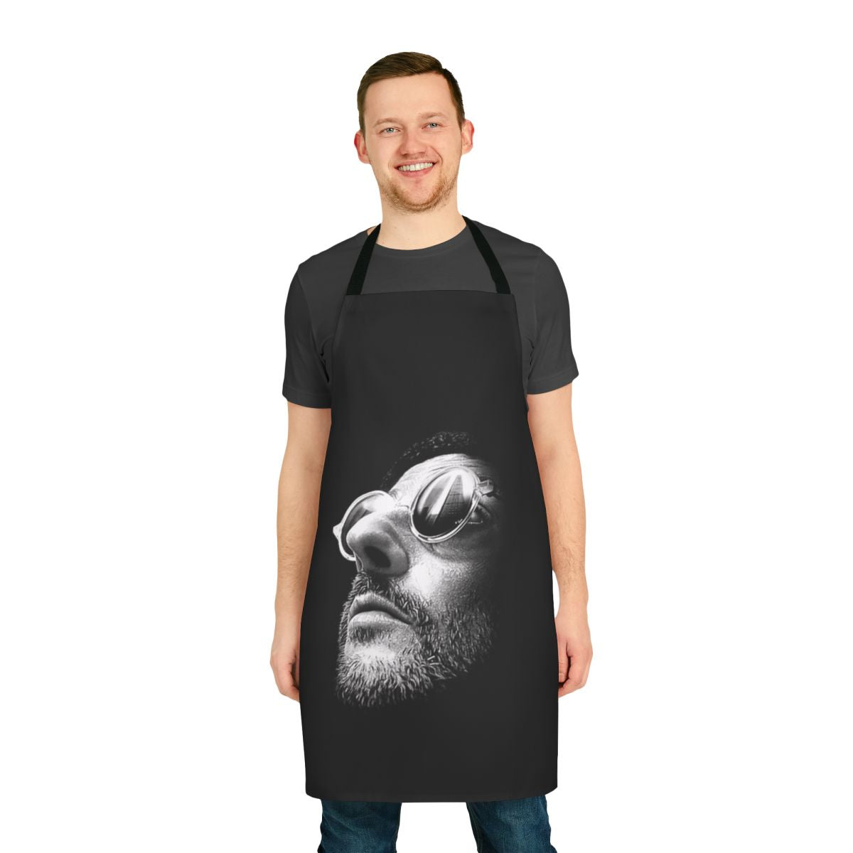 A yellow and black minimalist apron featuring artwork inspired by the 1994 film "The Professional"