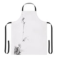 A black and white apron featuring a Japanese sumi e inspired design with the name Miyamoto Musashi and elements like a shrike, katana, and Japanese calligraphy.