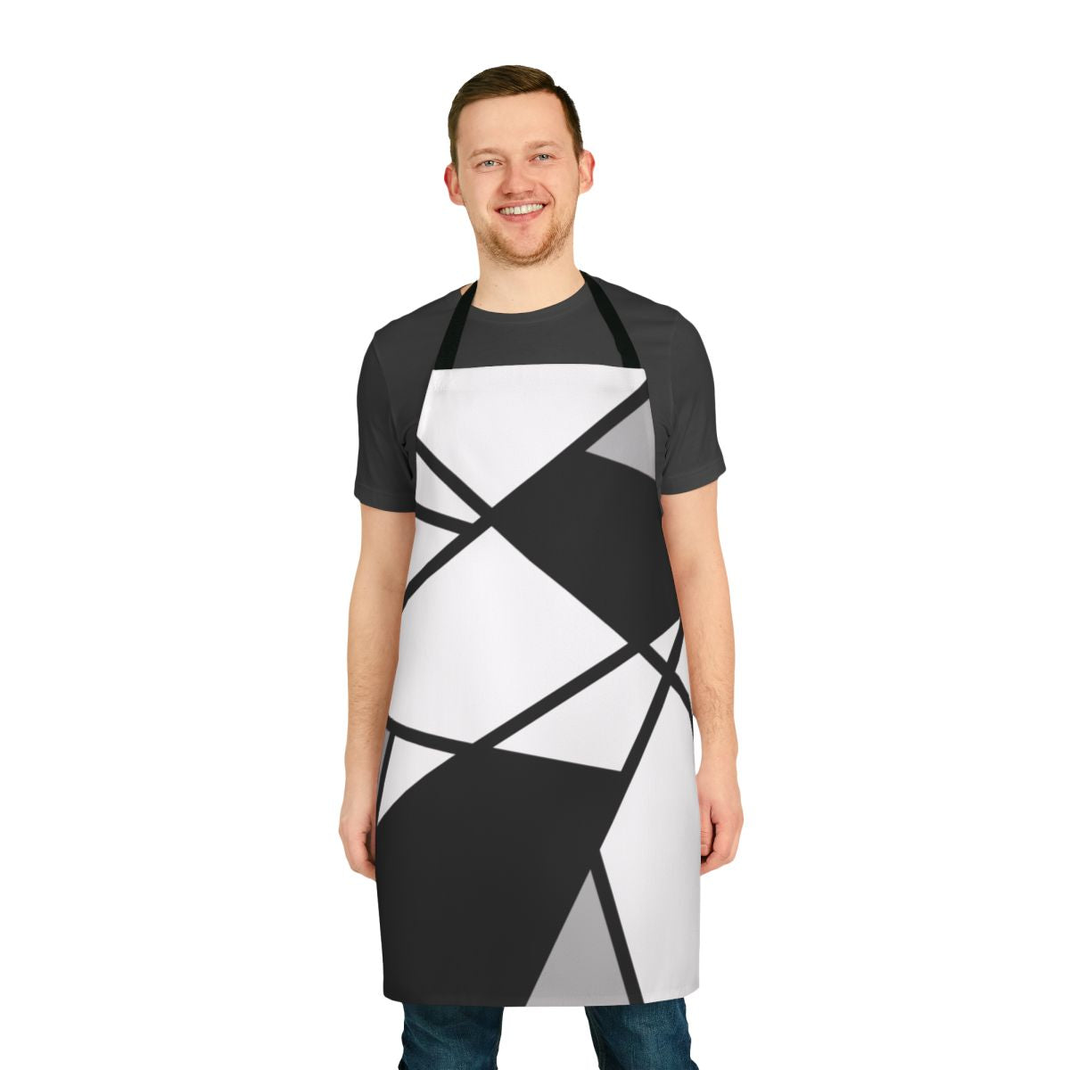 A stylish black and white geometric pattern apron with abstract lines and shapes