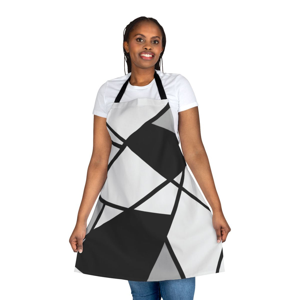 A stylish black and white geometric pattern apron with abstract lines and shapes