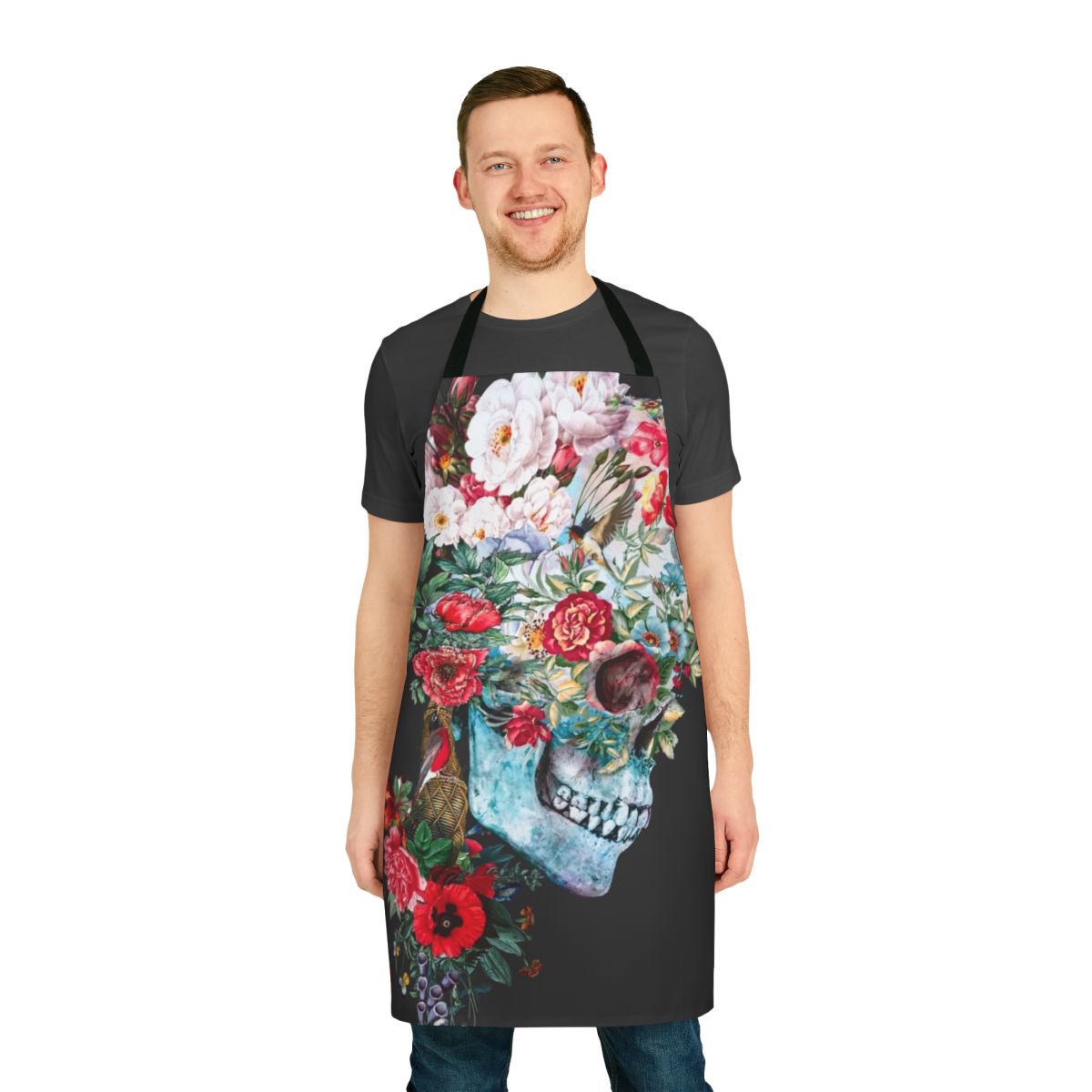 Momento Mori-inspired apron featuring a collage of skulls, birds, flowers, and botanical elements in a surreal, baroque-style design by artist Riza Peker.