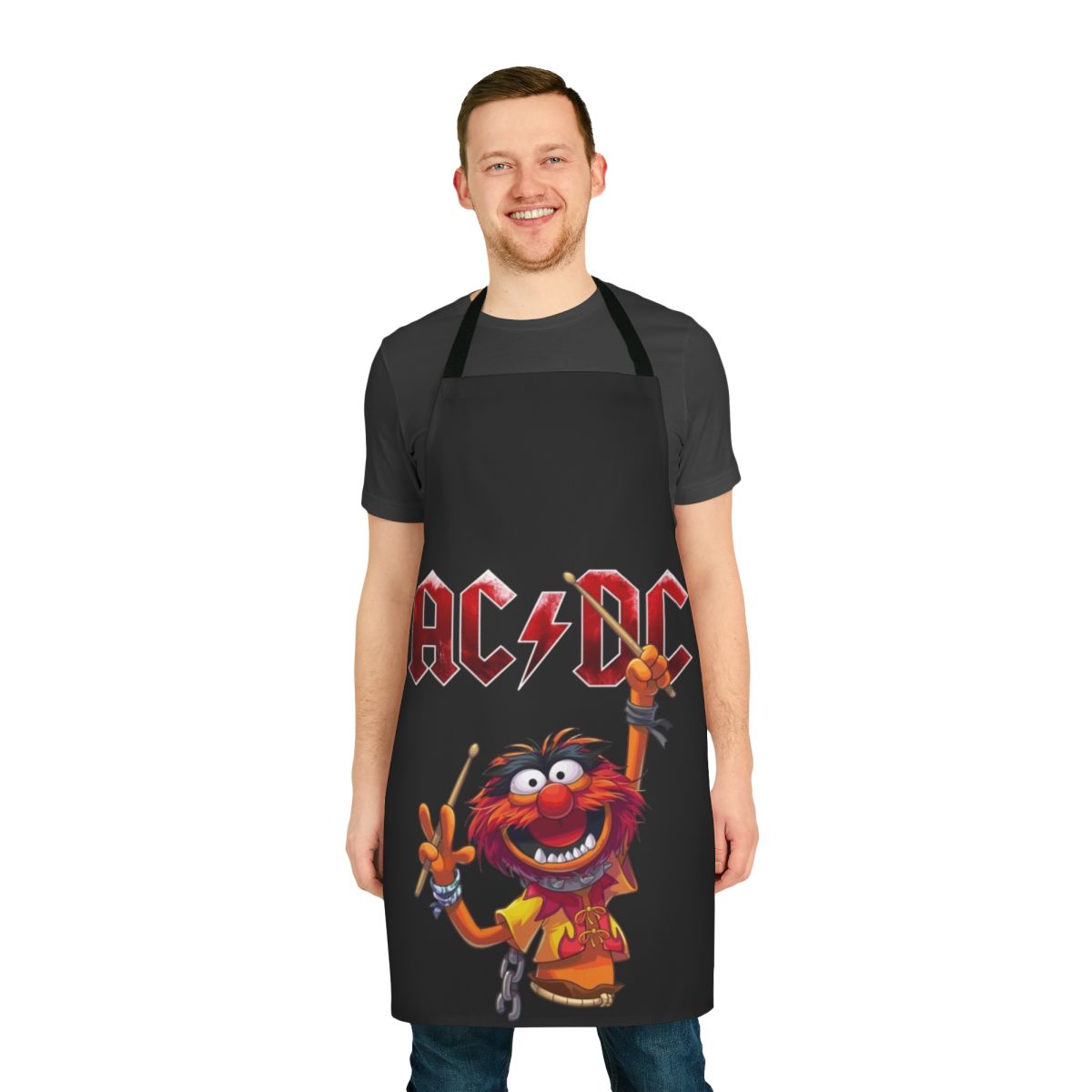 A vibrant and playful apron featuring the iconic Muppet character Animal as a drummer.