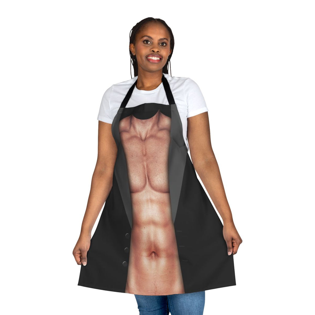 Photograph of a man wearing a novelty apron with a muscular torso design