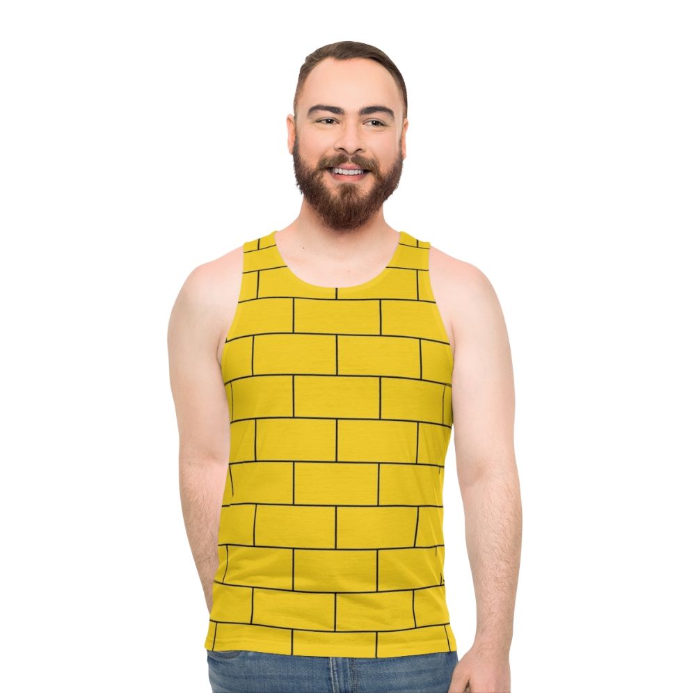 Mustard yellow unisex tank top with brick pattern graphic