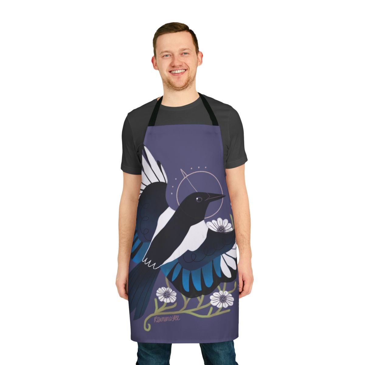 Whimsical apron featuring a magpie bird surrounded by purple flowers and stars