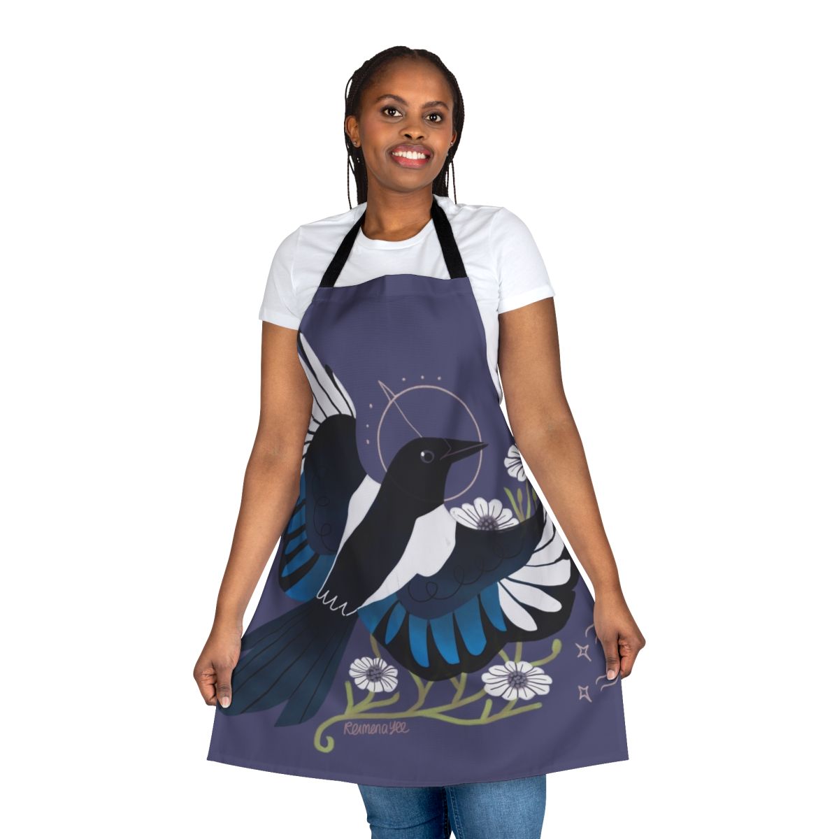 Whimsical apron featuring a magpie bird surrounded by purple flowers and stars