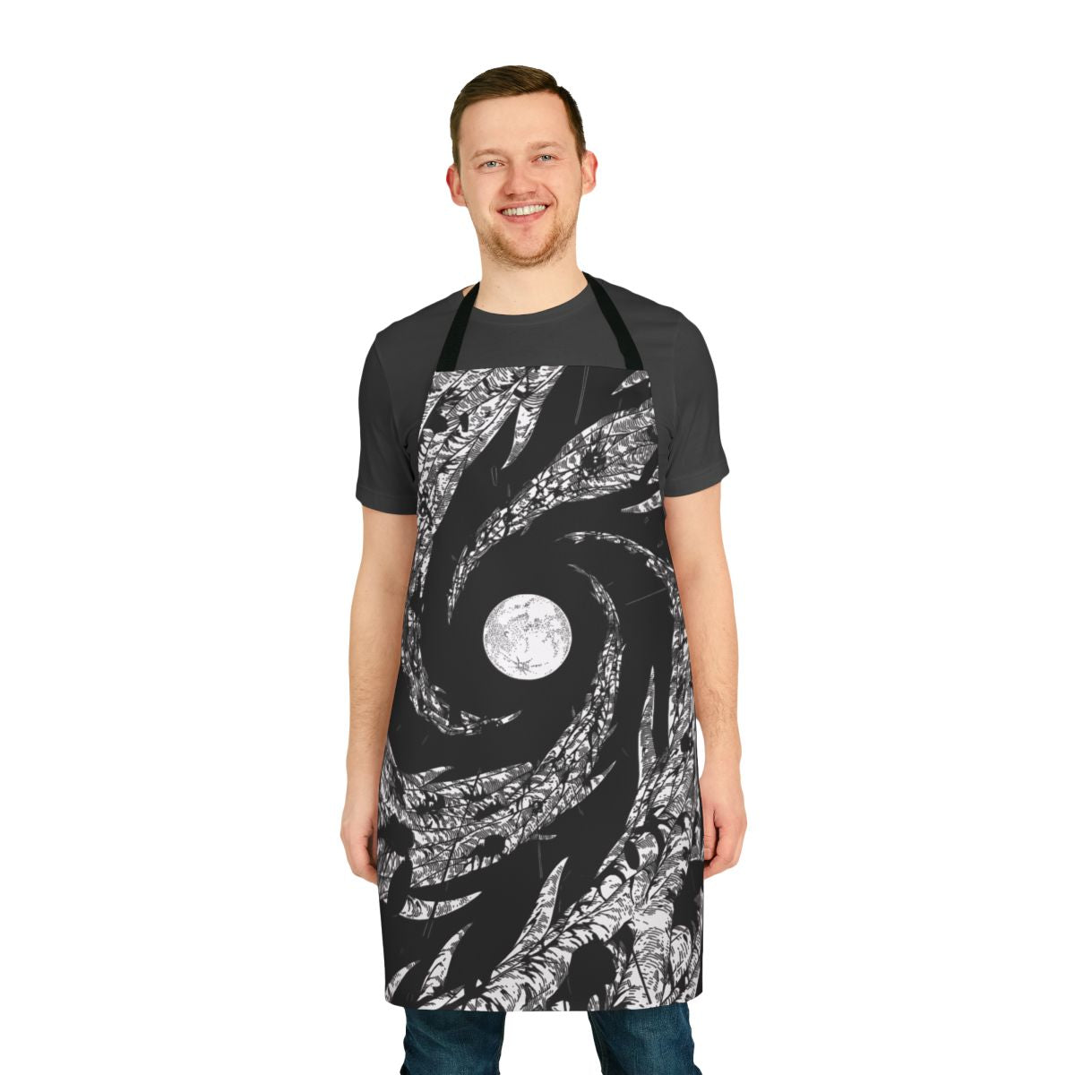 Apron with a design featuring a dark night sky, a moon, and silhouetted trees.