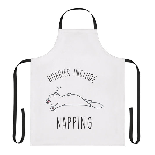 A playful apron with the text "Hobbies Include Napping" printed on it, perfect for the casual napping aficionado.