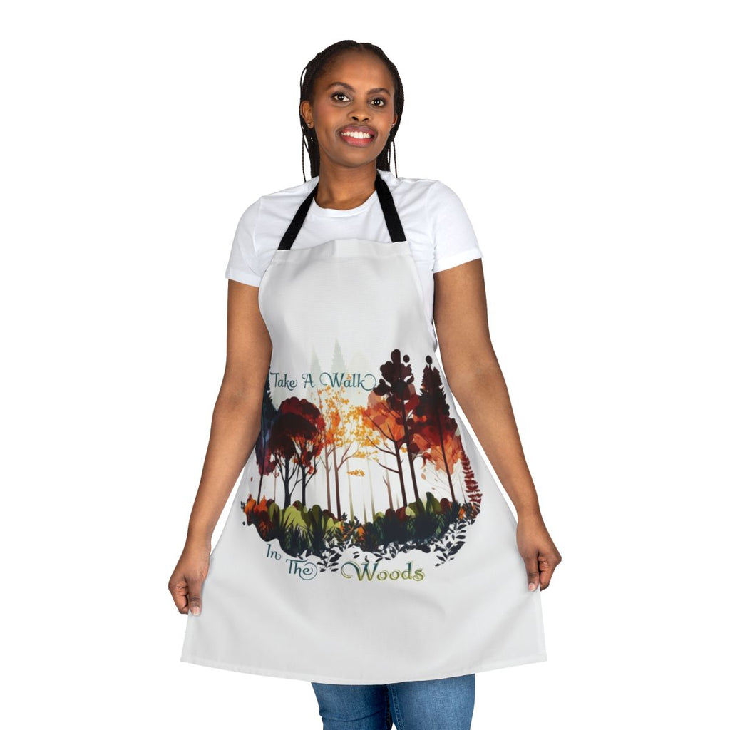 Model wearing a nature-themed apron while walking in a forest