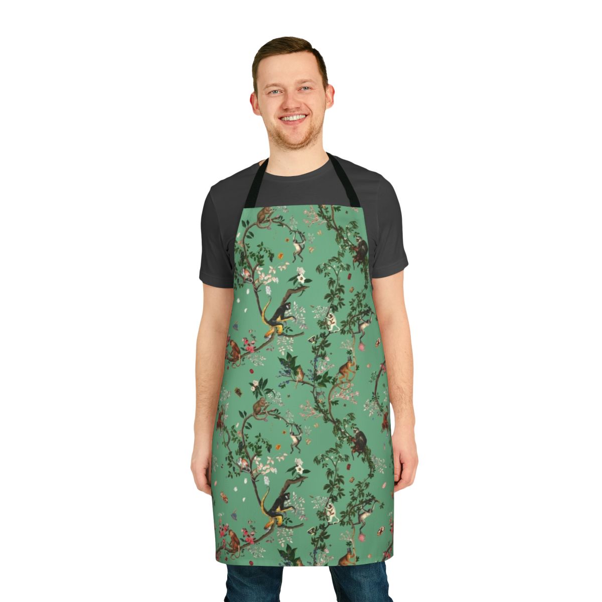 Lively and vibrant green apron featuring a monkey-themed floral design, perfect for the eco-conscious kitchen.