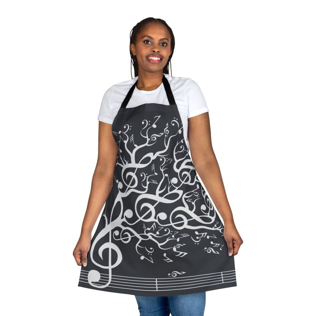 An apron featuring a nature-inspired design with musical notes and elements