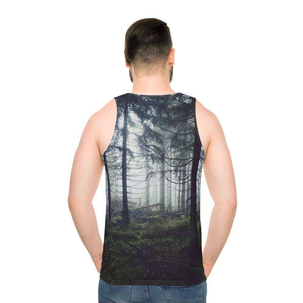 Person wearing unisex nature tank top standing in a forest