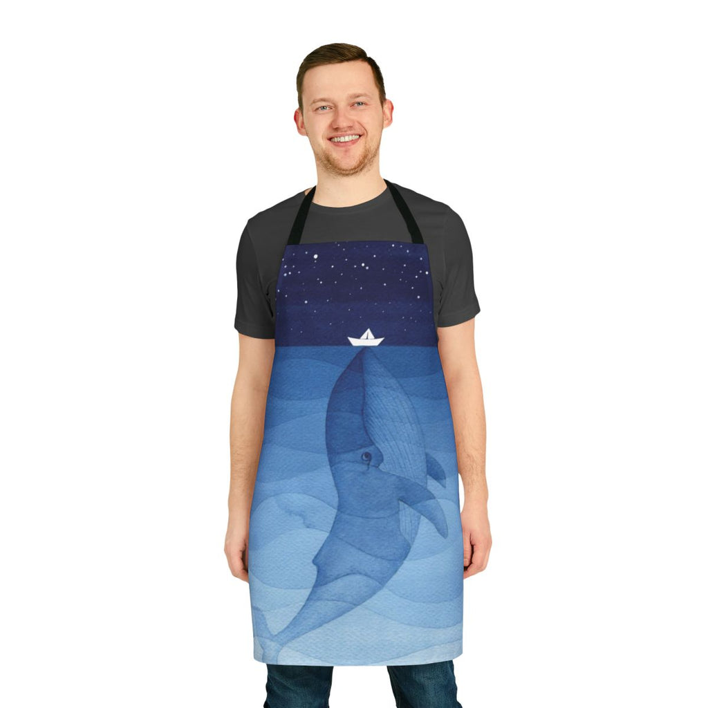 Vibrant watercolor illustration of a blue whale on a navy blue apron