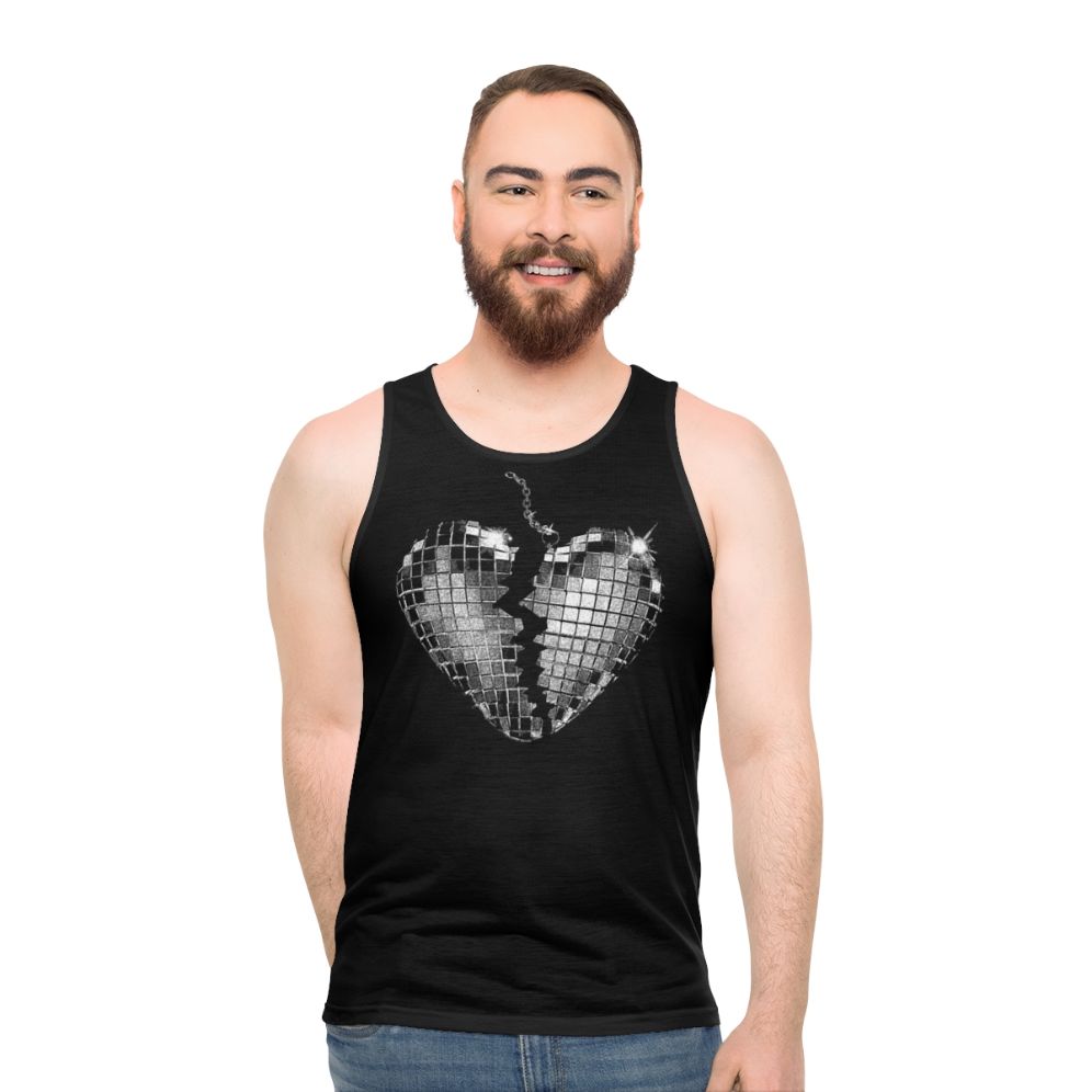 Unisex pop music tank top with "Nothing Breaks Like A Heart 3" design