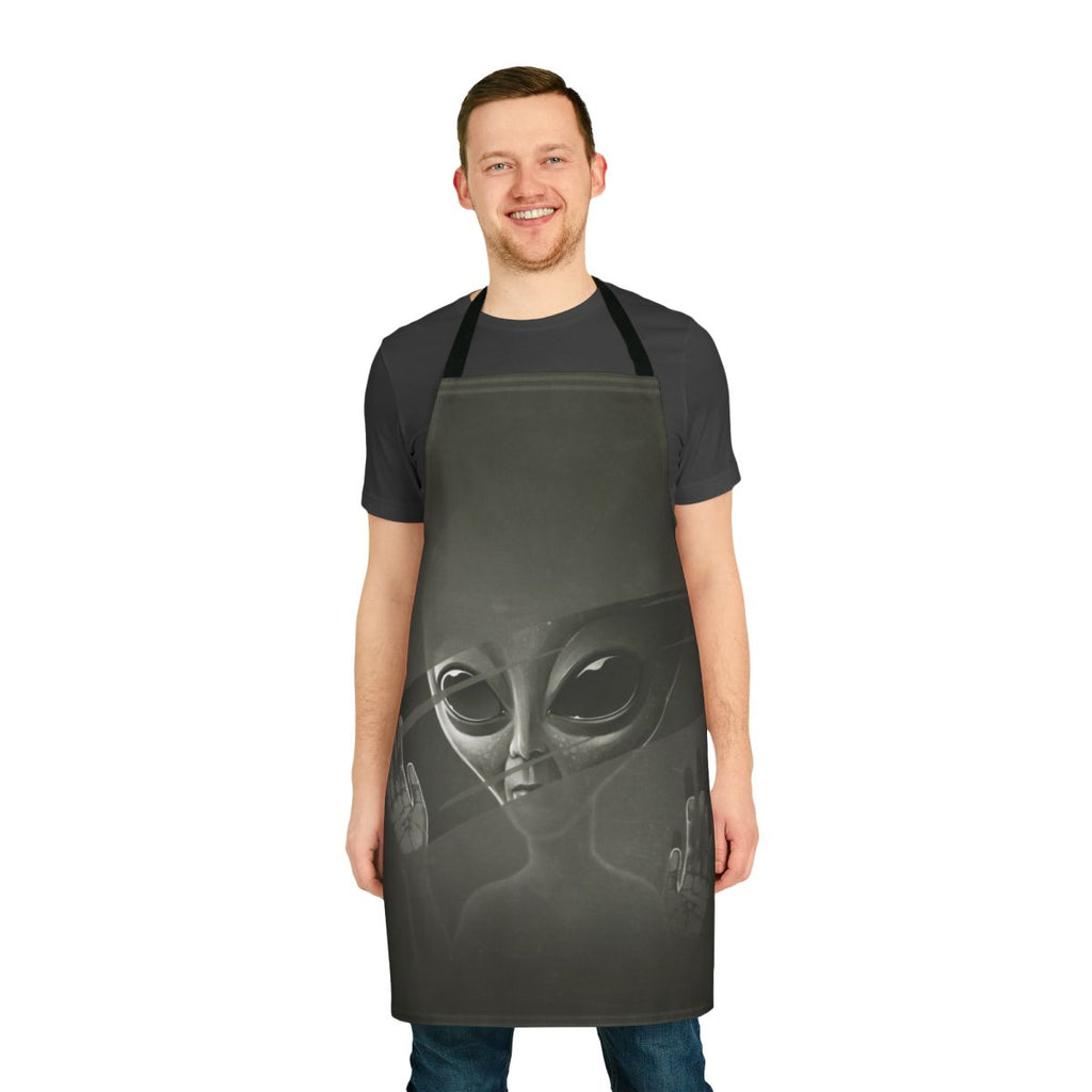 Illustration of a grey alien face on a black apron, perfect for sci-fi inspired cooking and kitchen tasks.