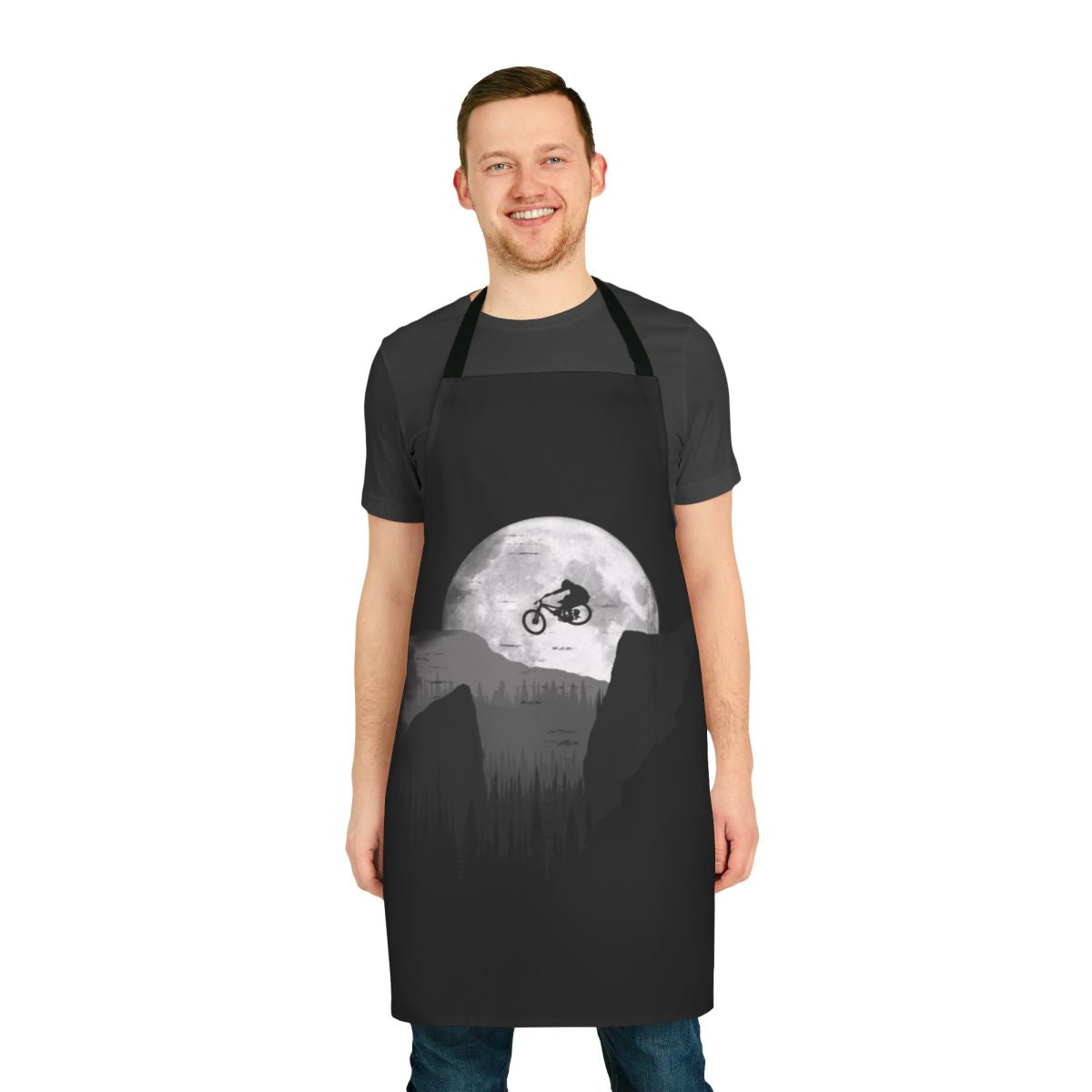 Mountain biker wearing a durable, stylish apron with a moon and bike graphic
