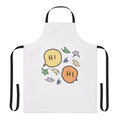Pastel green apron with a heartleaf graphic, inspired by the Heartstopper graphic novels