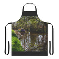 An apron featuring a peaceful canal barge and its reflections on the water.