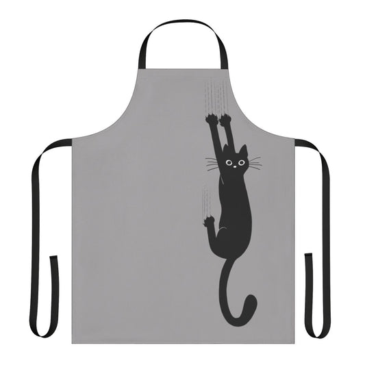 An illustration of a black cat clinging onto an apron with its sharp claws and an expression of determination on its face.