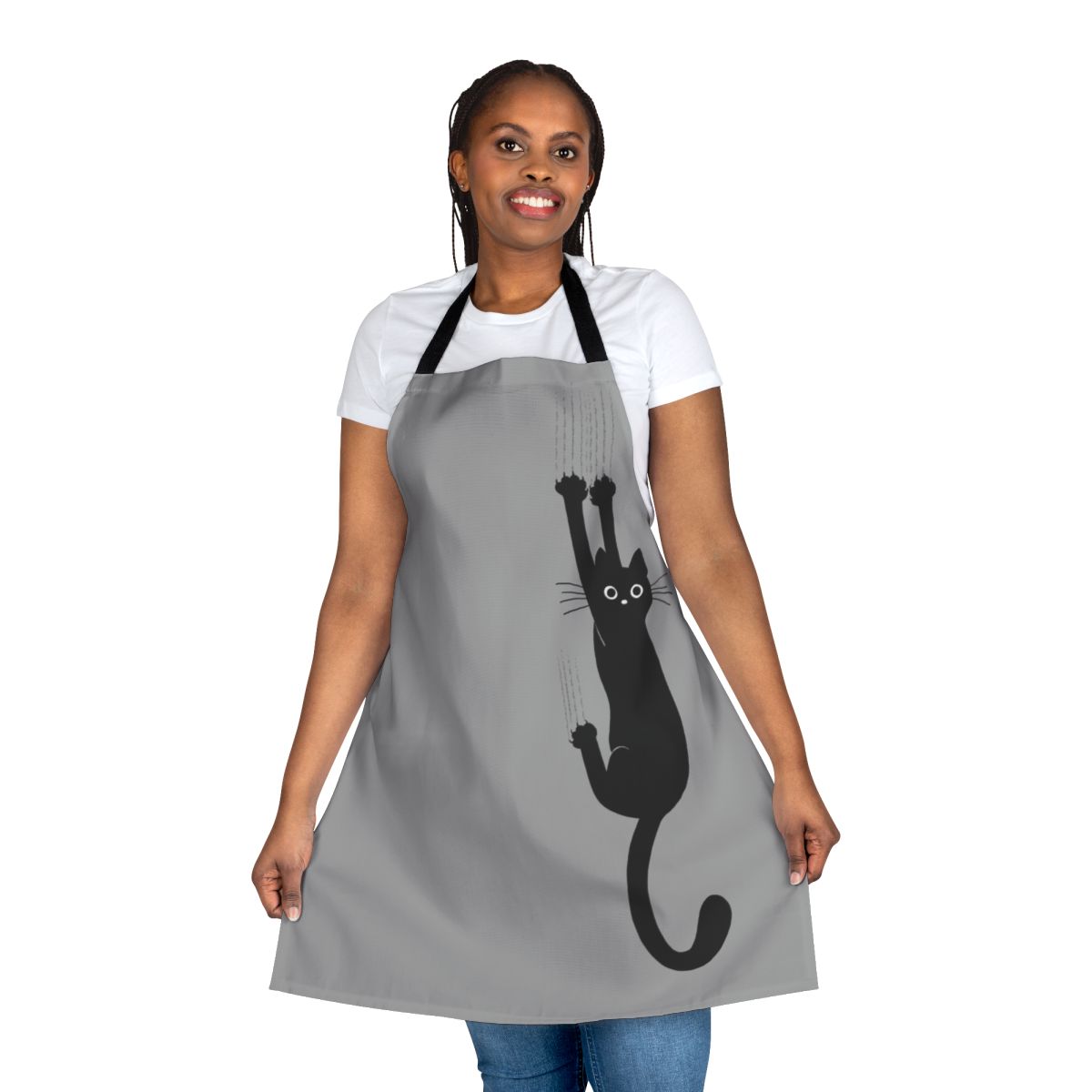 An illustration of a black cat clinging onto an apron with its sharp claws and an expression of determination on its face.