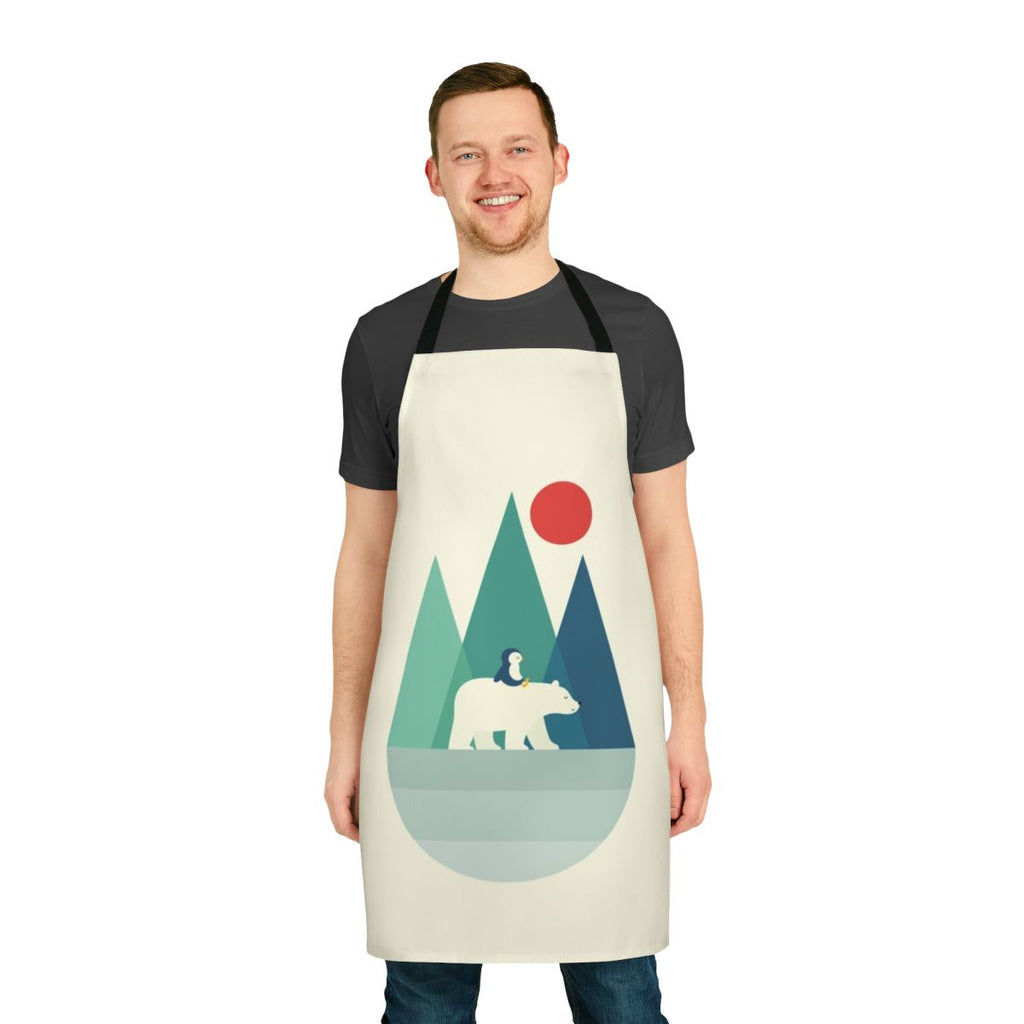 A vibrant and whimsical apron featuring a polar bear design against a backdrop of geometric mountains, sunrise, and sunset colors.