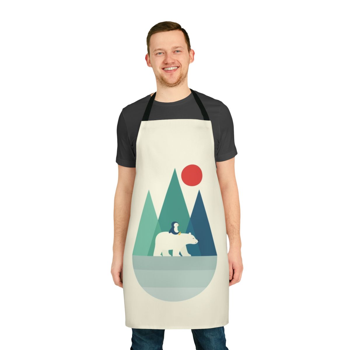 A vibrant and whimsical apron featuring a polar bear design against a backdrop of geometric mountains, sunrise, and sunset colors.