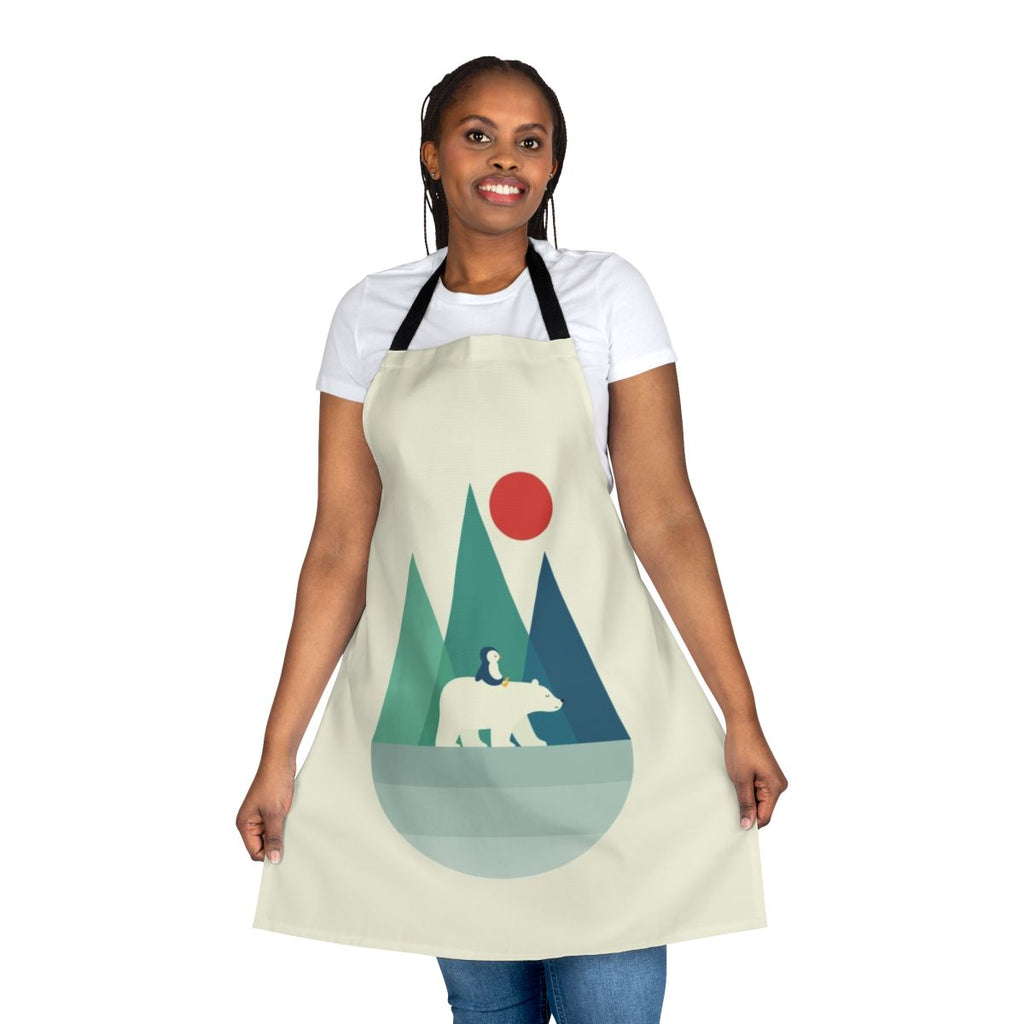 A vibrant and whimsical apron featuring a polar bear design against a backdrop of geometric mountains, sunrise, and sunset colors.