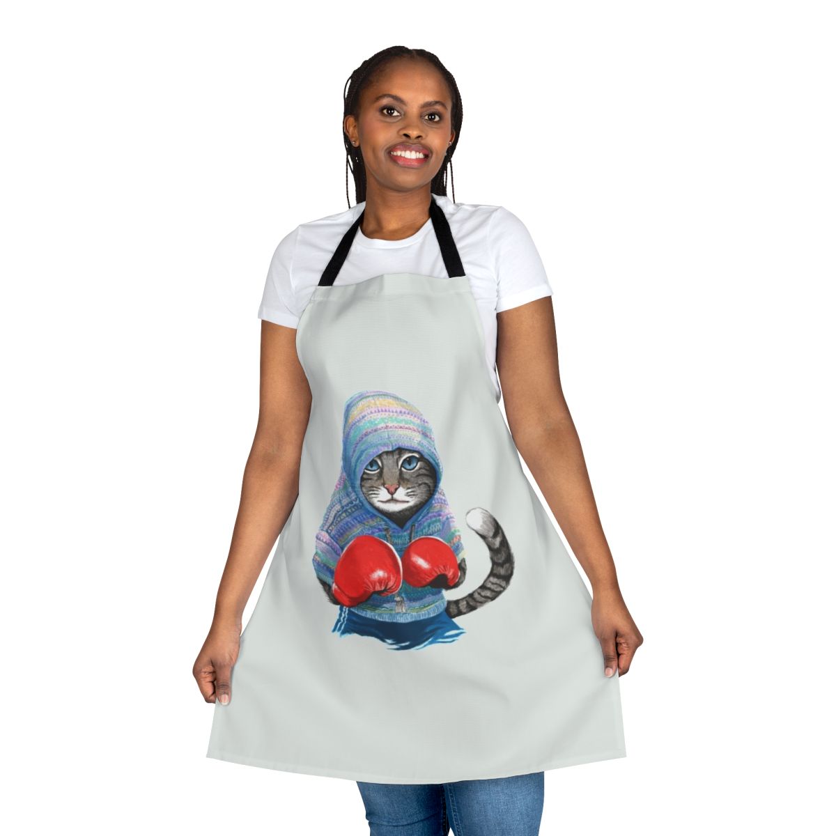 A blue and red patterned apron featuring a playful boxing cat design.
