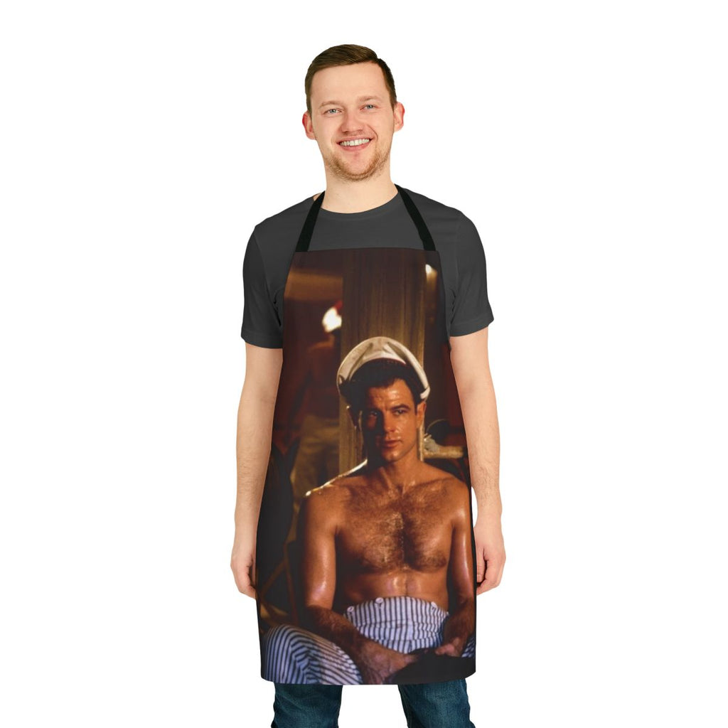 Apron featuring a topless, hairy-chested man in a naval uniform, inspired by the classic gay film Querelle.